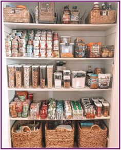 a pantry filled with lots of food and storage baskets on top of white shelving