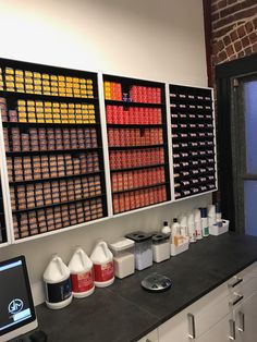 several different types of sodas are lined up on the wall