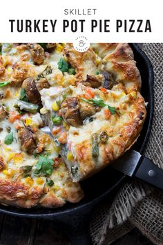 a pizza sitting on top of a pan covered in cheese and vegtables