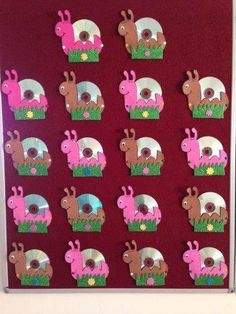 a bulletin board with many different animals on it's sides and holes in the middle