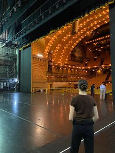 a man standing in front of an empty stage