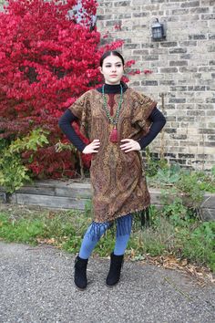 "❥Pashmina Ethnic Print Tunic, hand made using a large scarf/wrap ❥Material is thick and warm for fall/winter ❥open at the sides from hip down for easily slipping on and off ❥Beautiful Indian beaded Print ❥inspired by boho hippie fashion ❥fits size small/medium/large ❥measurements bust fits up to 42\" Hips fit up to 44\" Sleeve is open model is size small medium, this will also fit a large (i am 42\" bust and 44\" hip and this fits me loosely as well :) ❥shipping -All shipping within CANADA and One Size Bohemian Wraps For Winter, One Size Bohemian Winter Wraps, Bohemian Winter Wraps One Size, Traditional Fringe Poncho For Fall, Bohemian Shawl Wrap For Fall, Traditional One-size Wraps For Fall, Traditional Fall Poncho With Fringe, Brown Shawl Wrap For Fall, Fall Brown Shawl Wrap