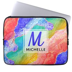 a colorful laptop case with the letter m on it