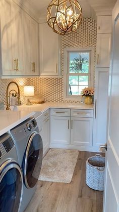 a washer and dryer in a white laundry room