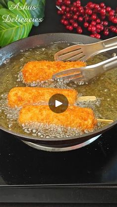 two pieces of chicken being cooked in a skillet