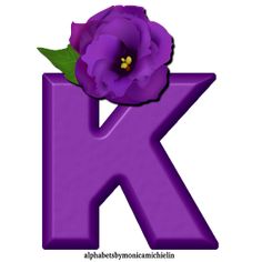 the letter k has a purple flower on it