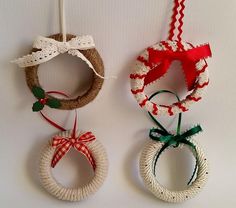 three christmas wreaths hanging on the wall