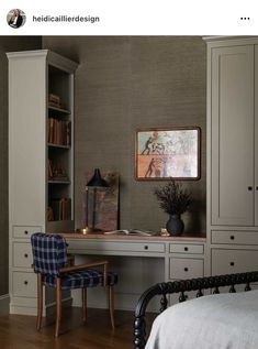 a bedroom with a bed, desk and bookshelf