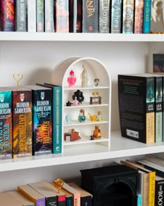 the bookshelf is filled with many different types of books