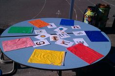 a child's table that has been set up with letters and numbers on it