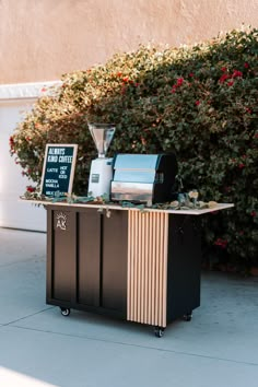 an outdoor coffee cart on the sidewalk