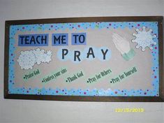 a bulletin board that says teach me to pray with pictures of hands and snowflakes