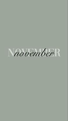 the word november written in black on a gray background