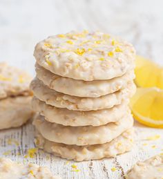 a stack of cookies with lemon zest on top