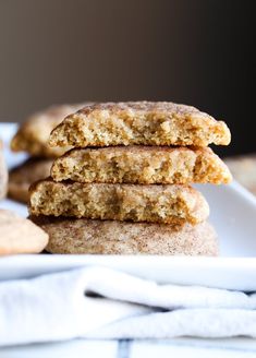 a stack of cookies sitting on top of a white plate