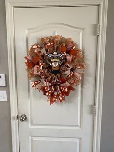 a door with a wreath hanging on it