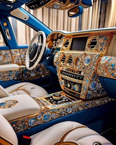 the interior of a luxury car decorated in blue and gold