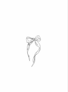 a black and white drawing of a bow tied to a ribbon on the side of a wall