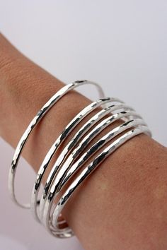 Stacking Bangle in Sterling Silver Sterling Silver Bangle Set Set of 7 Bangles Thin Stacking Bangles Silver Bracelet Set 7 Day Bangles Description Metal :- 925 Sterling Silver Style : Bangle/Bracelet/  Theme : Wedding Party Gemstone:- no Occasion : Birthday Events, Lovely Valentine's Day Gift, Anniversary Gift, Weeding Gift, Engagement Ring, Lover Gift Ring, Hen Party And Other Occasion.... Your order will be handmade and ready for shipment in 1 to 2 business days This stunning and elegant set o Stacking Bangles, Bangles Silver, Bracelet Set Silver, Birthday Events, Stackable Bangles, Stacking Bracelets, The Bangles, Sterling Silver Bangle, Hammered Sterling Silver