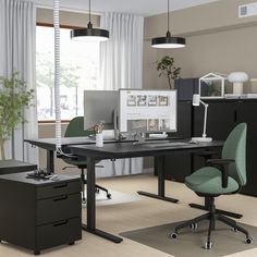 an office with two desks and one chair in front of the computer monitor on the desk