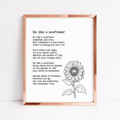 a framed print with the poem be like a sunflower