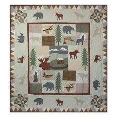 a quilt with animals and trees on it