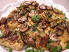 a pizza with mushrooms on it sitting on top of a white countertop next to a green border