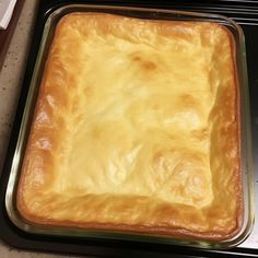 a square casserole sitting on top of a metal pan