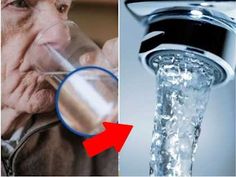 an old man drinking water from a faucet and then looking at the camera