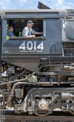 an old man sitting in the caboose of a train