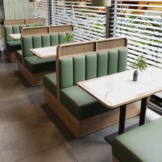 some green chairs and tables with plants on them in a restaurant or bar area that looks like it could be used for luncheonning