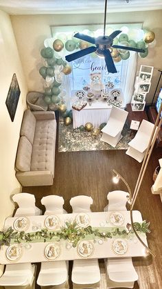 a living room filled with furniture and balloons