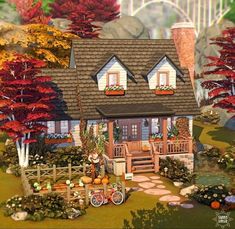 a small house surrounded by trees and flowers in the fall season with autumn foliages