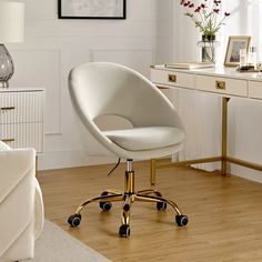 a white office chair sitting on top of a hard wood floor next to a desk