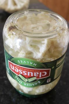 a glass jar filled with food sitting on top of a counter