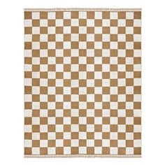 a brown and white checkered rug with fringes