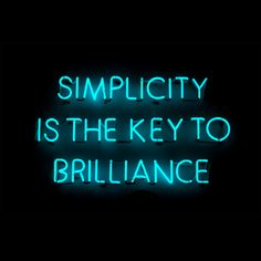 a neon sign that says simplicity is the key to brillance