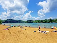 many people are on the beach and in the water