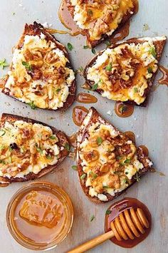 toasted bread with various toppings and honey