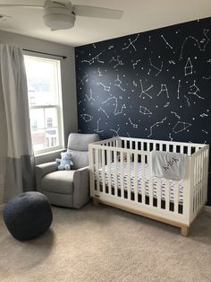 a baby's room with stars painted on the wall