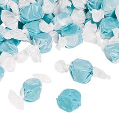 blue and white candies are scattered on top of each other