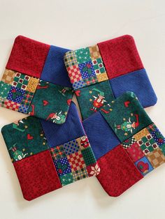 four pieces of colorful patchwork on top of each other