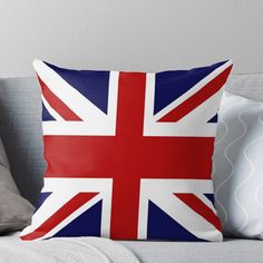 the british flag is shown on a couch with pillows and throw pillow covers in various colors