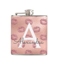 a pink flask with lipstick on it and the word alexandria written in black ink