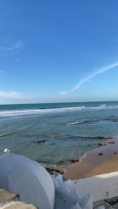 an ocean view with steps leading to the beach