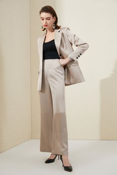 Elegant Champagne Wide Leg Loose Fit professional women's business pantsuit. Peak lapels; front button blazer V-Neck, Long sleeves; button cuffs. Structured shoulders. Chest welt pockets. Hip flap pockets Polyester 100% Imported Brand - Aision Model Number - 203018C1 Beige Suits Women, Beige Tuxedo, Pantsuit For Women, Professional Women, Blazer Buttons, Welt Pockets, Business Women, Duster Coat, Caramel