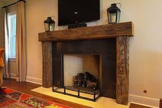 a living room with a fire place and a flat screen tv mounted above the fireplace