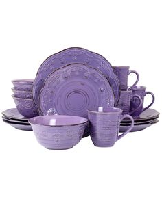 purple dishes and cups are stacked on top of each other