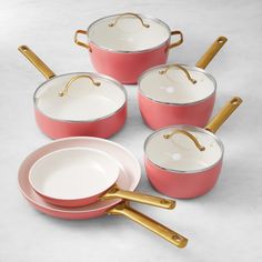 pink pots and pans with gold handles