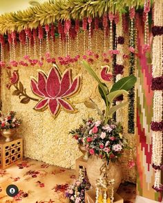 a decorated stage with flowers and garlands